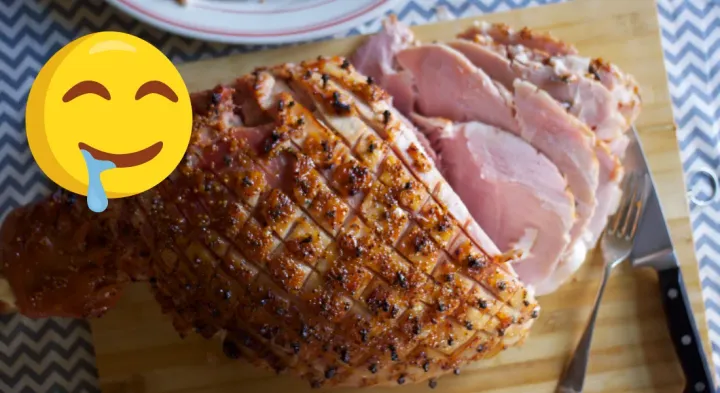 Image: A glazed and carved Christmas Ham, with a drooling smiley face emoji