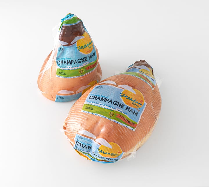 Image: A half and whole wrapped Freedom Farms Champagne Ham (aka your Christmas lunch)