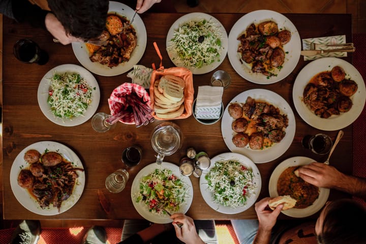 Image: A dinner table from above, filled with delicious food